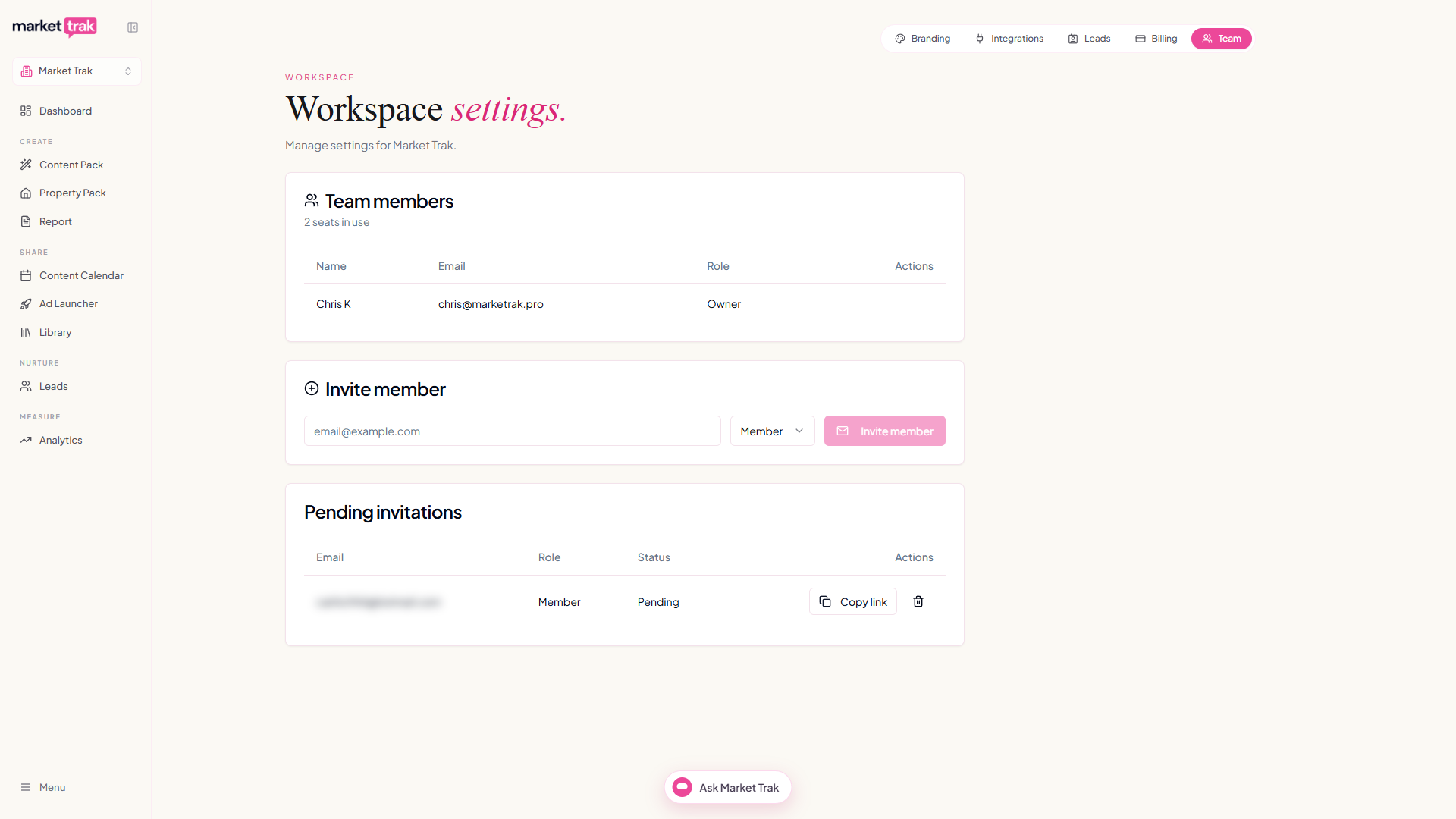 The Team tab in Workspace Settings with the members table, invite form and pending invitations (invite email blurred)